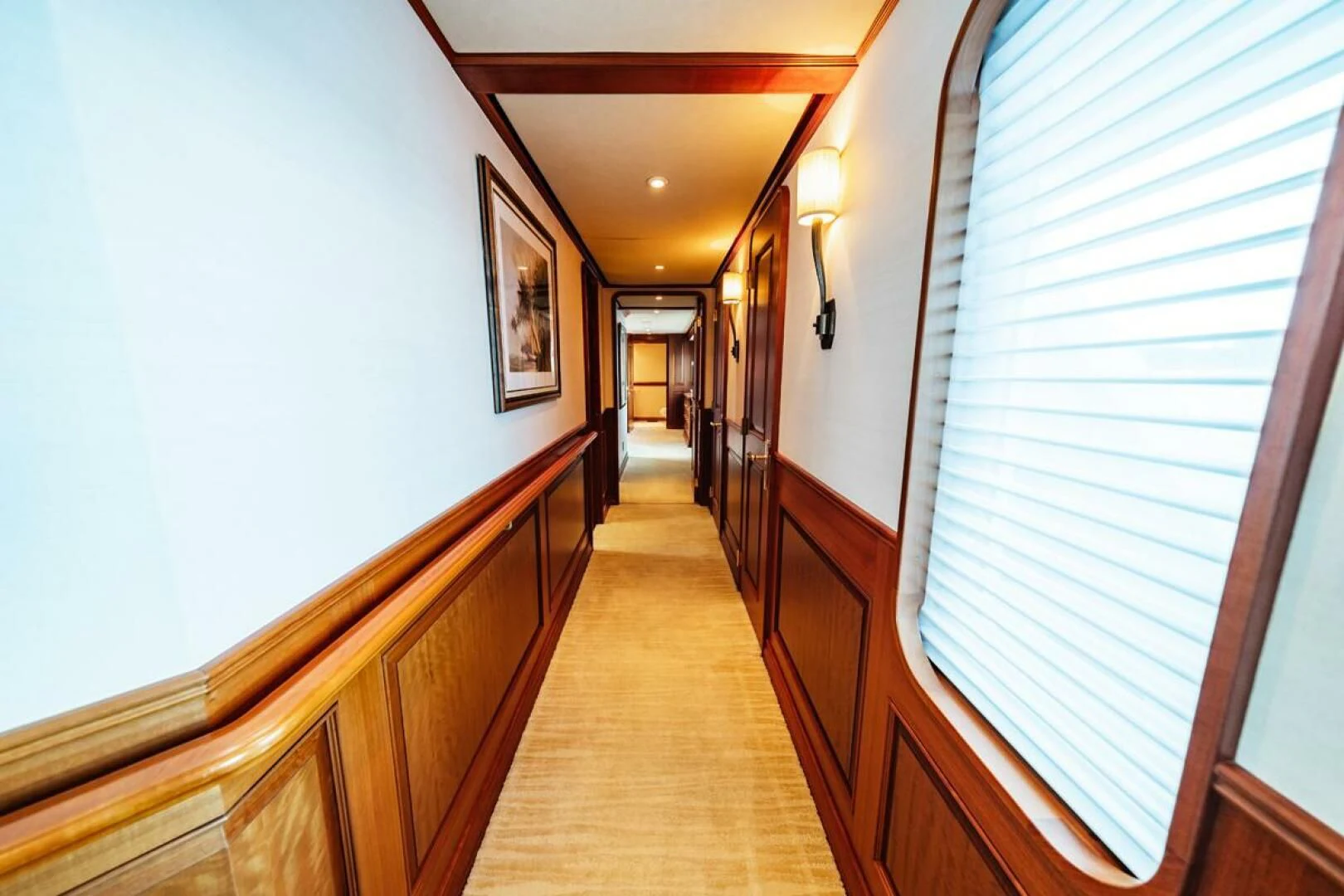 a hallway with wood cabinets aboard LEGACY Yacht for Sale