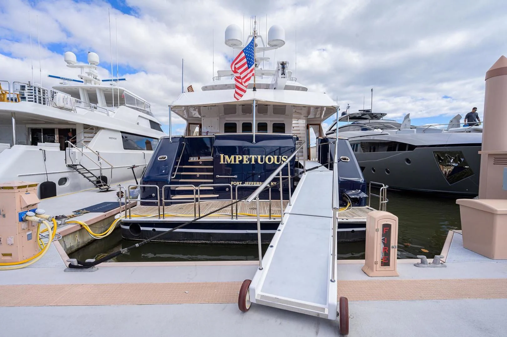 a boat docked at a pier aboard LEGACY Yacht for Sale