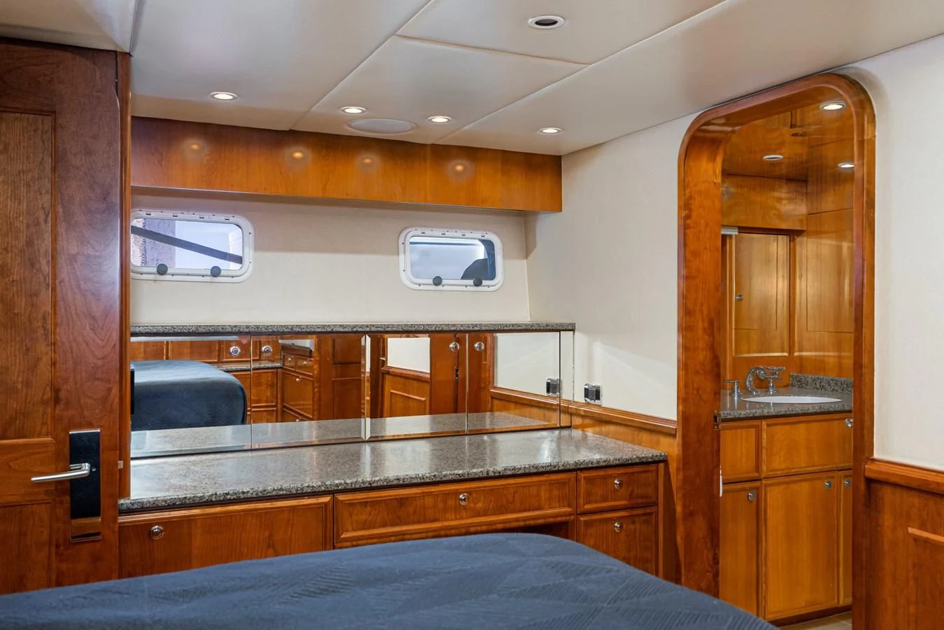 a kitchen with wooden cabinets aboard LONE WOLF Yacht for Sale