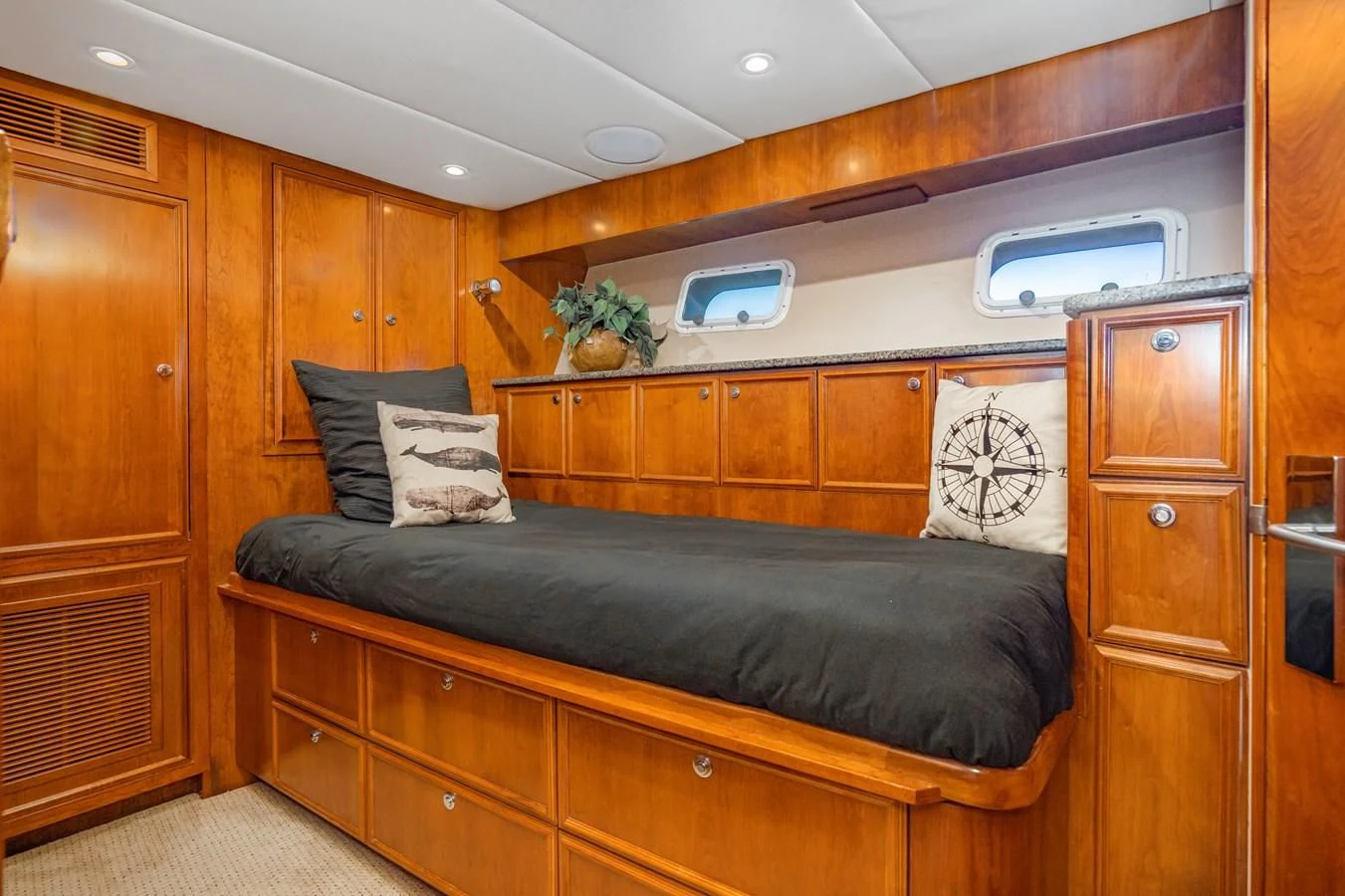 a wood cabinet in a room aboard LONE WOLF Yacht for Sale