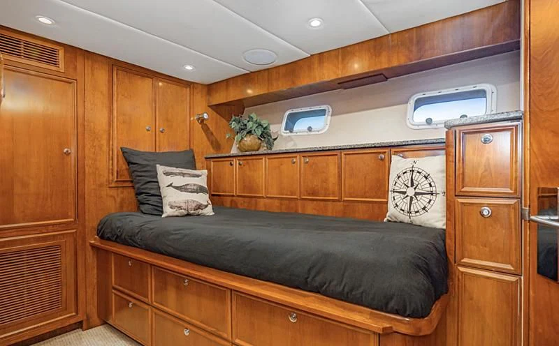 a bed in a room aboard LONE WOLF Yacht for Sale
