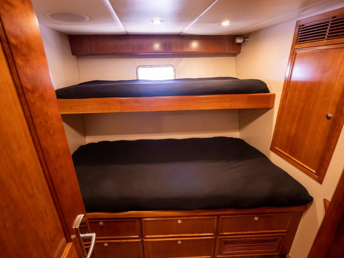 a room with a bed and a window aboard LONE WOLF Yacht for Sale
