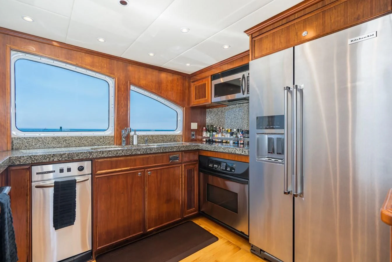 a kitchen with stainless steel appliances aboard LONE WOLF Yacht for Sale