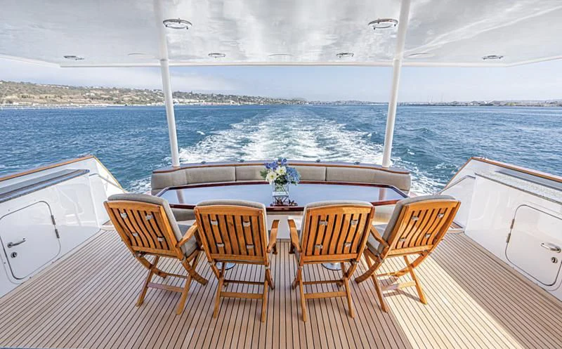 a group of chairs on a deck overlooking the ocean aboard LONE WOLF Yacht for Sale