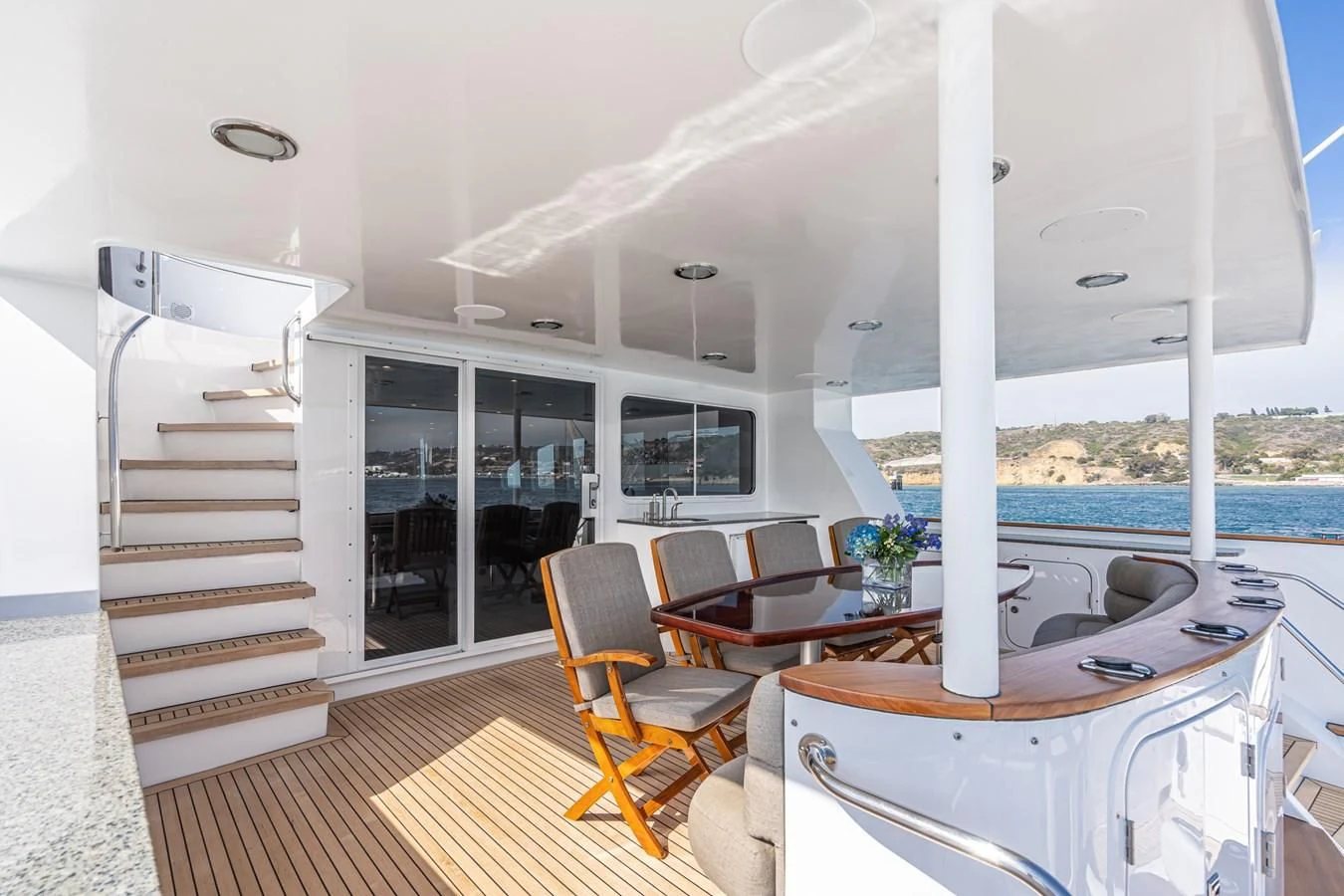 a room with a table and chairs aboard LONE WOLF Yacht for Sale
