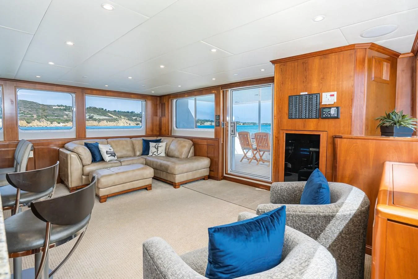 a living room with a fireplace aboard LONE WOLF Yacht for Sale