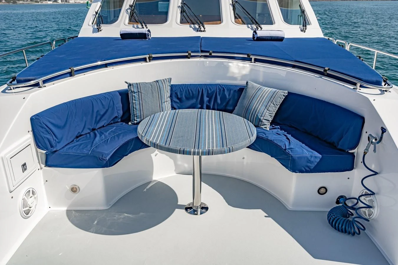a boat with a table and umbrella on it aboard LONE WOLF Yacht for Sale