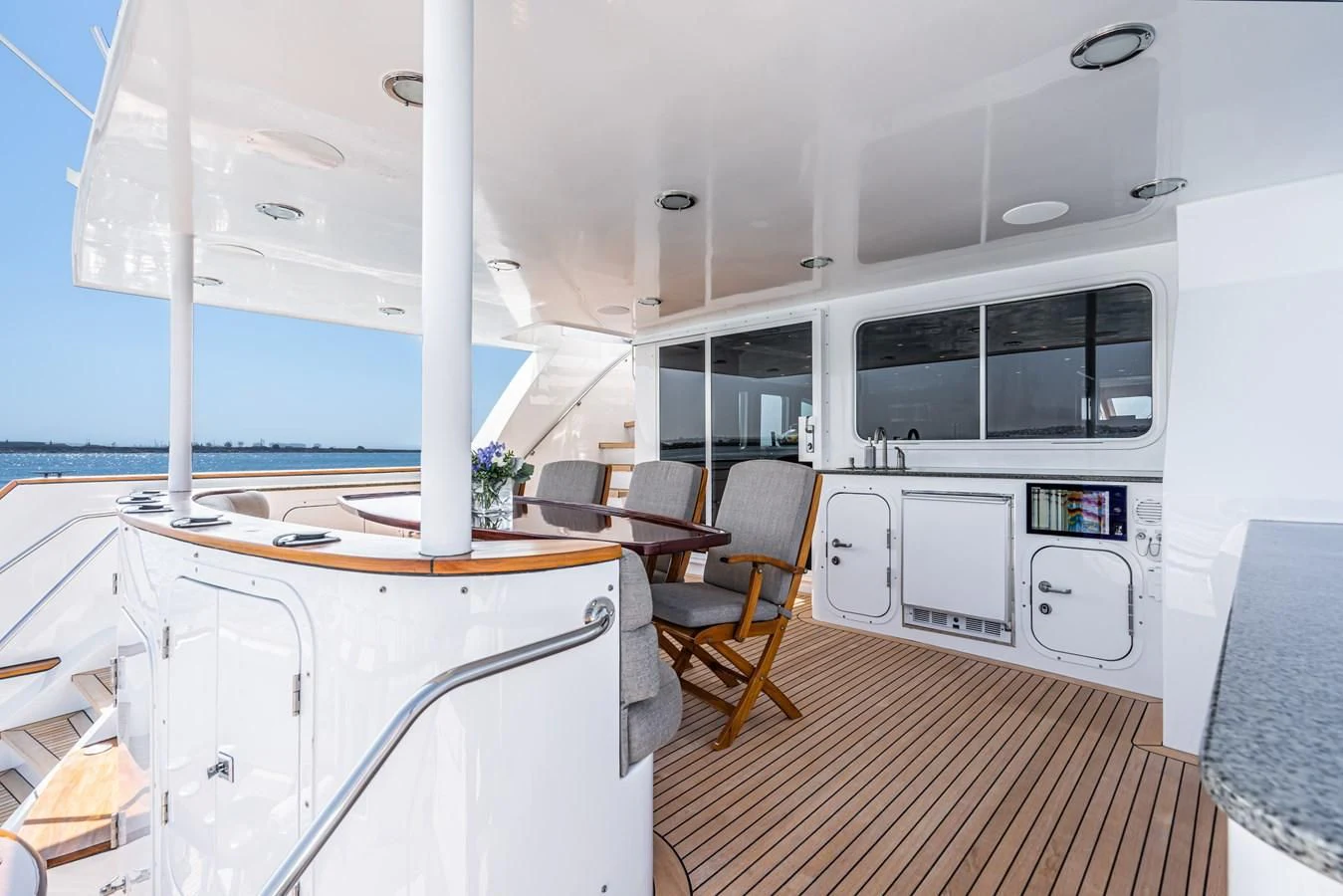 a room with a table and chairs aboard LONE WOLF Yacht for Sale