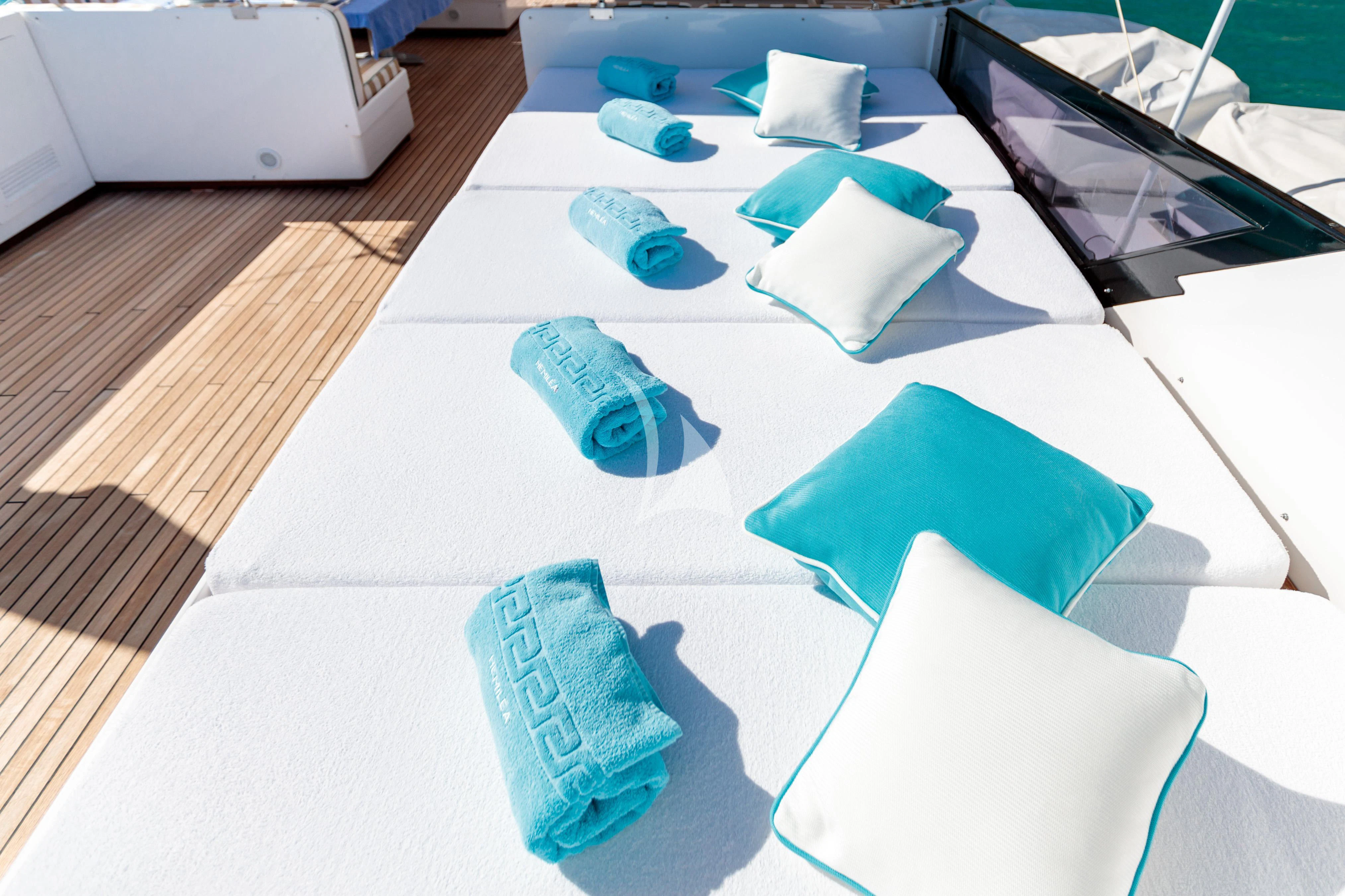 a group of blue and white cubes on a table aboard HEMILEA Yacht for Charter