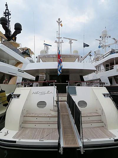 a large ship with a group of boats on it aboard HEMILEA Yacht for Charter