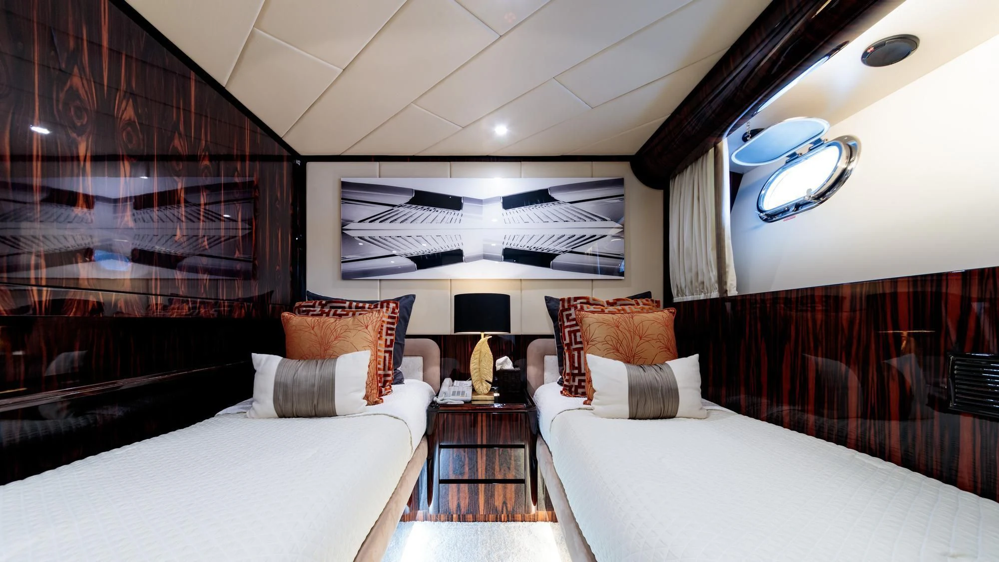 a room with a bed and a mirror aboard HEMILEA Yacht for Charter