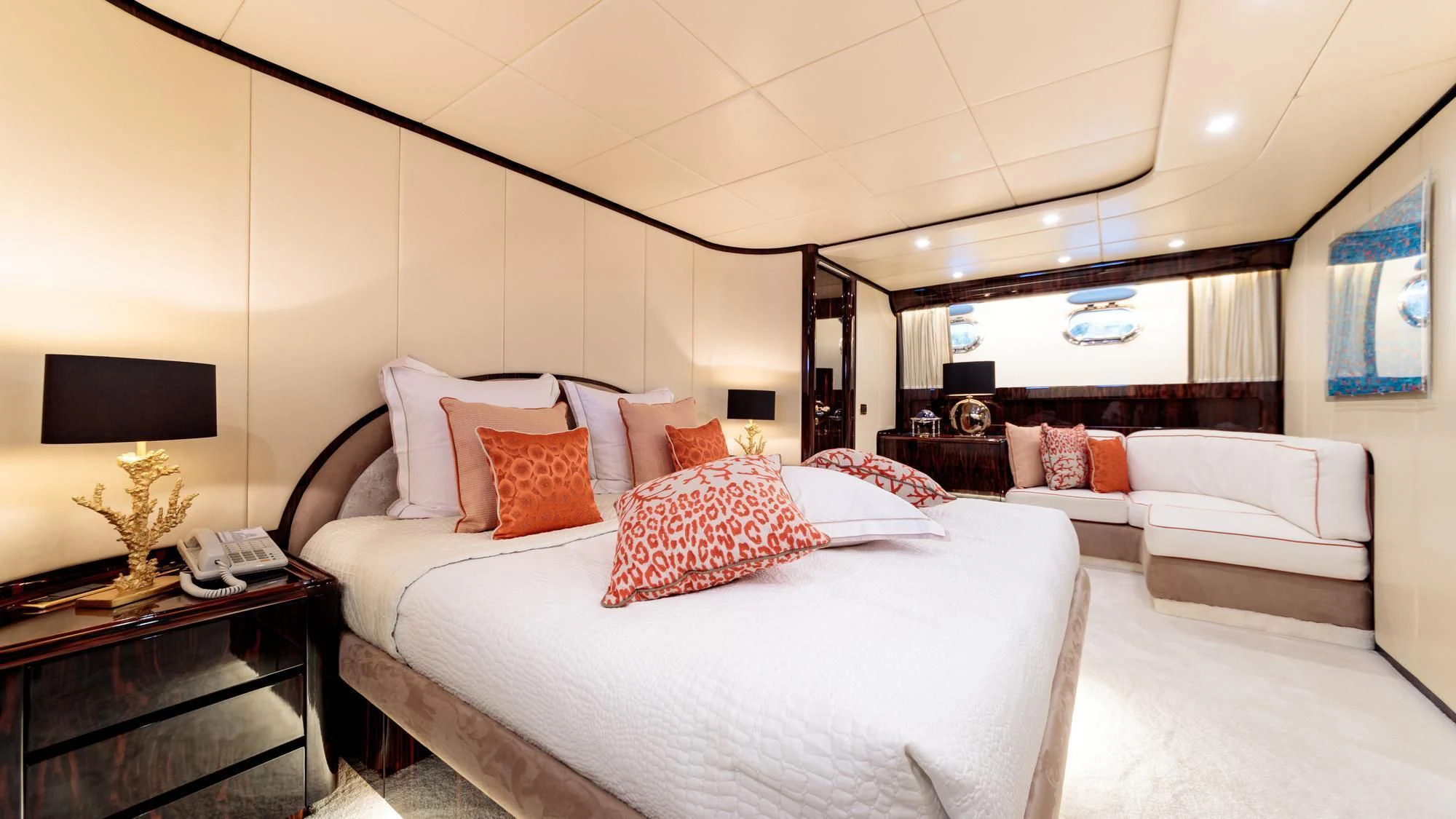 a large bedroom with a bed and a tv aboard HEMILEA Yacht for Charter