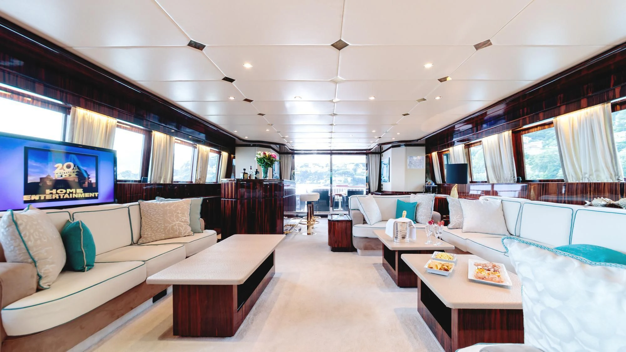 a living room with a large window aboard HEMILEA Yacht for Charter
