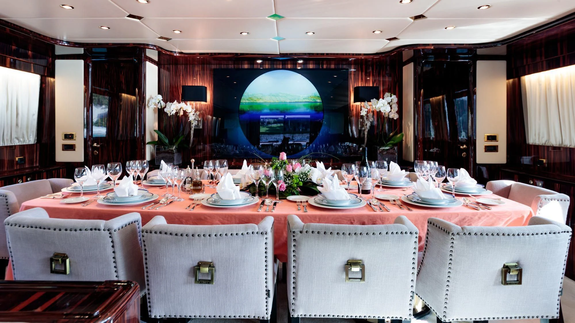 a large room with tables and chairs aboard HEMILEA Yacht for Charter
