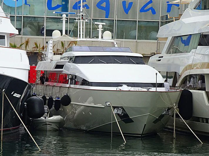 a couple of boats are parked in a harbor aboard HEMILEA Yacht for Charter