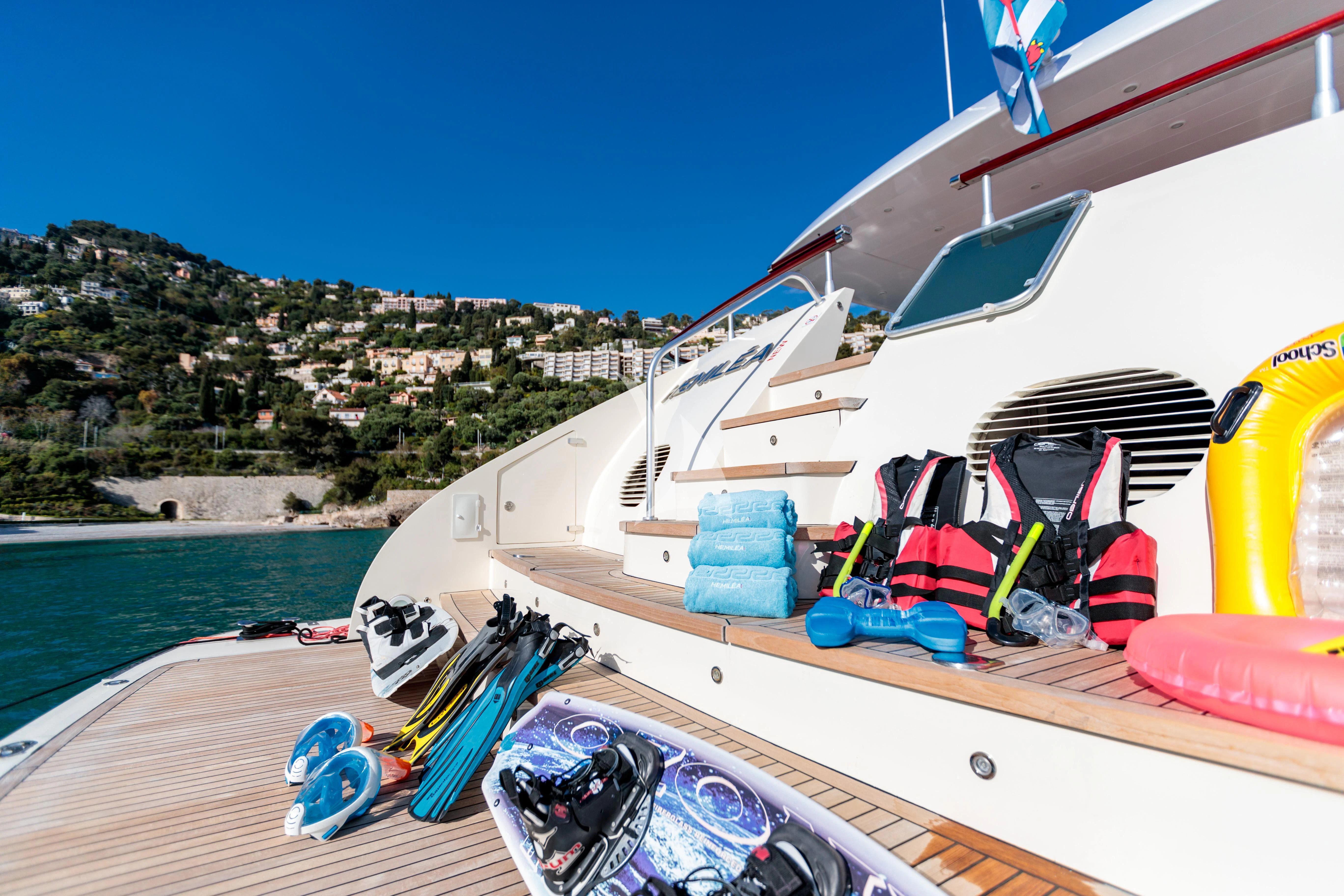 a boat with a deck and a pile of stuff on it aboard HEMILEA Yacht for Charter
