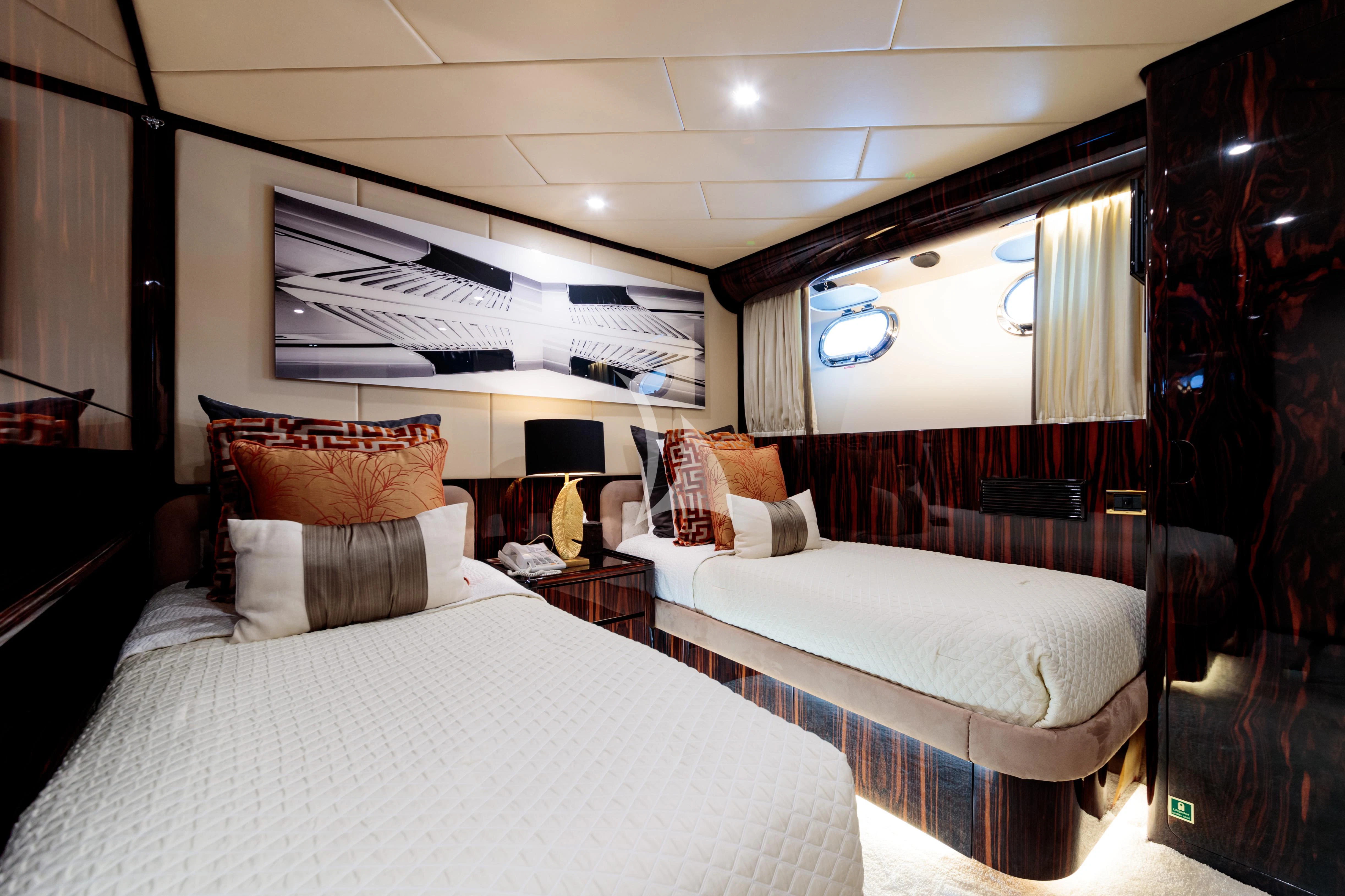 a room with two beds aboard HEMILEA Yacht for Charter