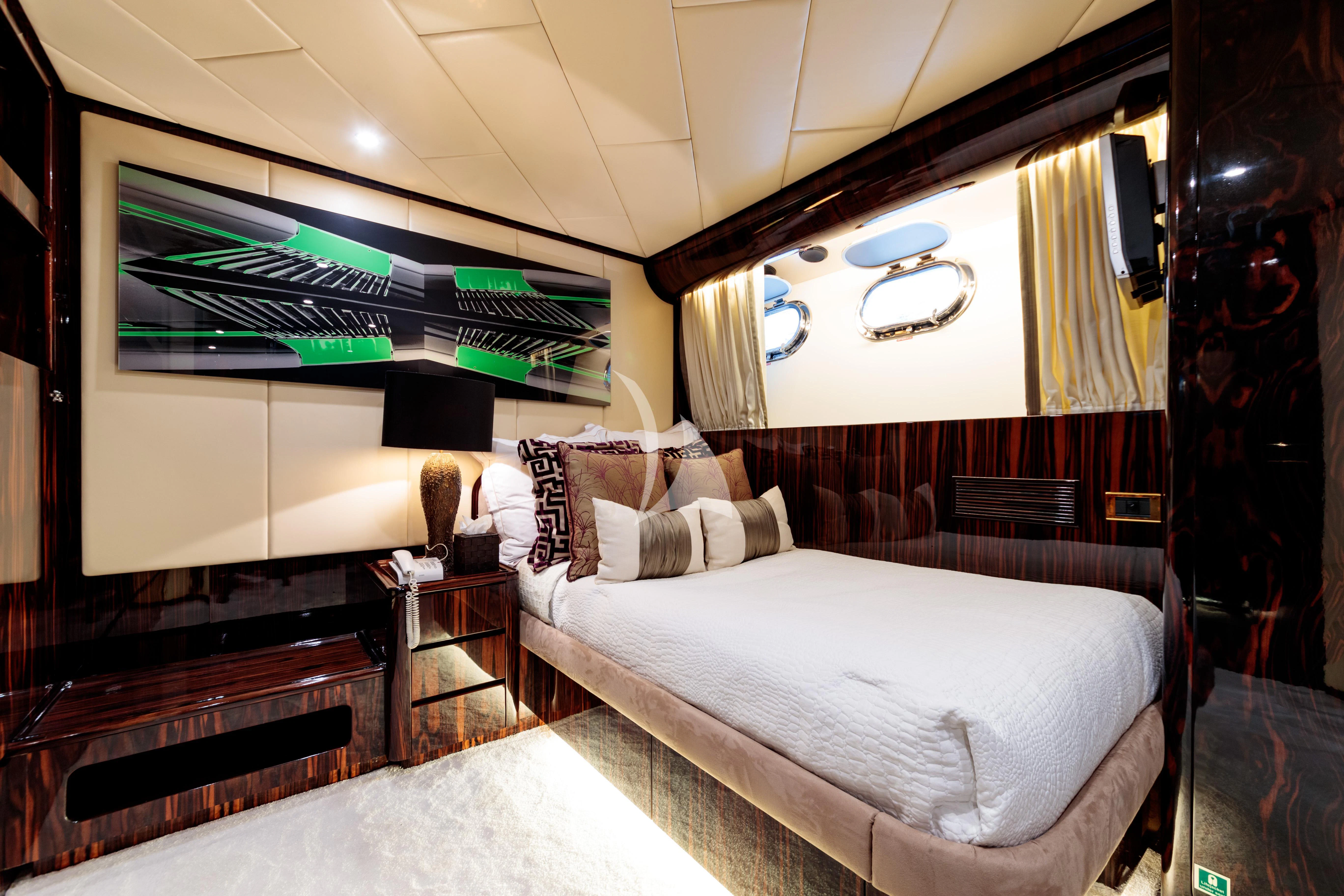 a room with a bed and a mirror aboard HEMILEA Yacht for Charter