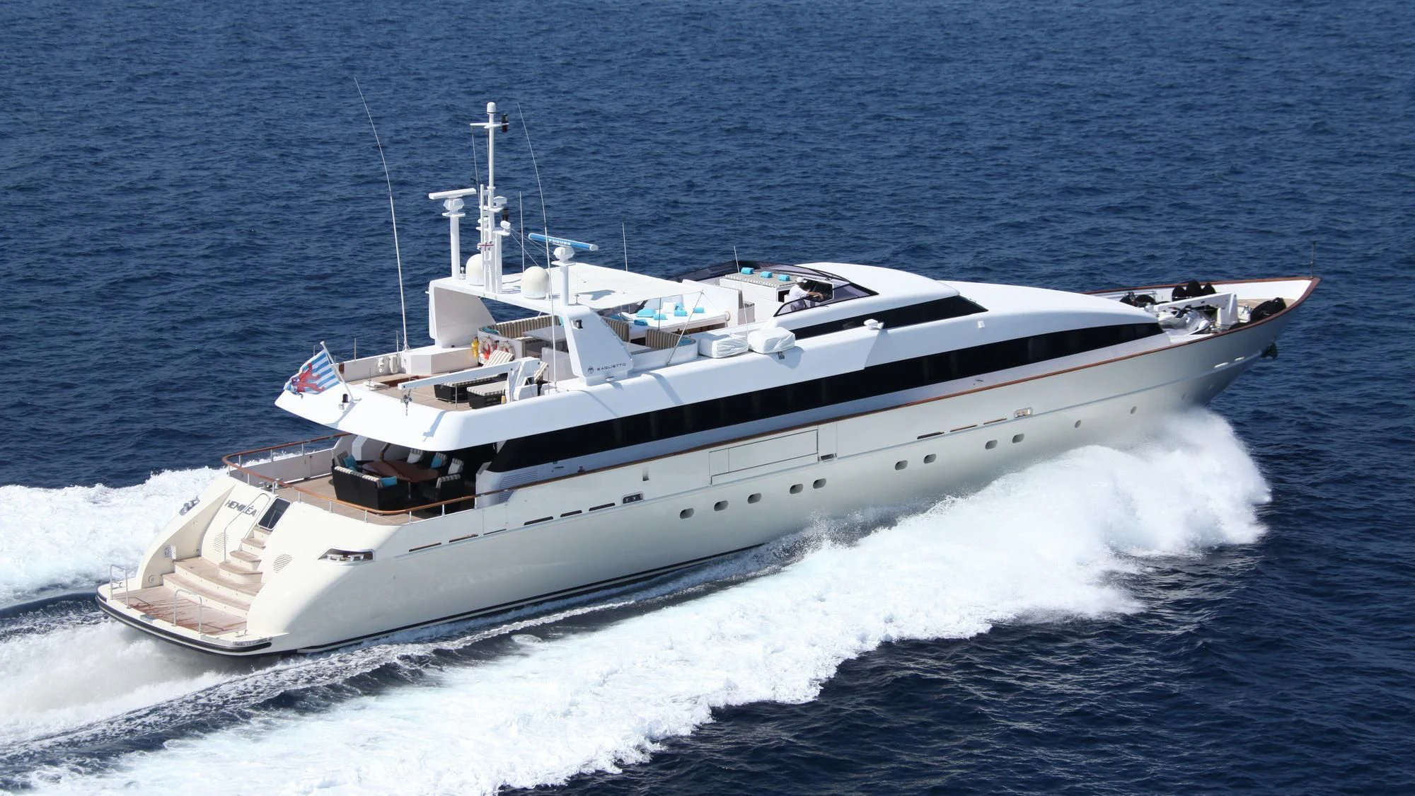 a white yacht on the water aboard HEMILEA Yacht for Charter