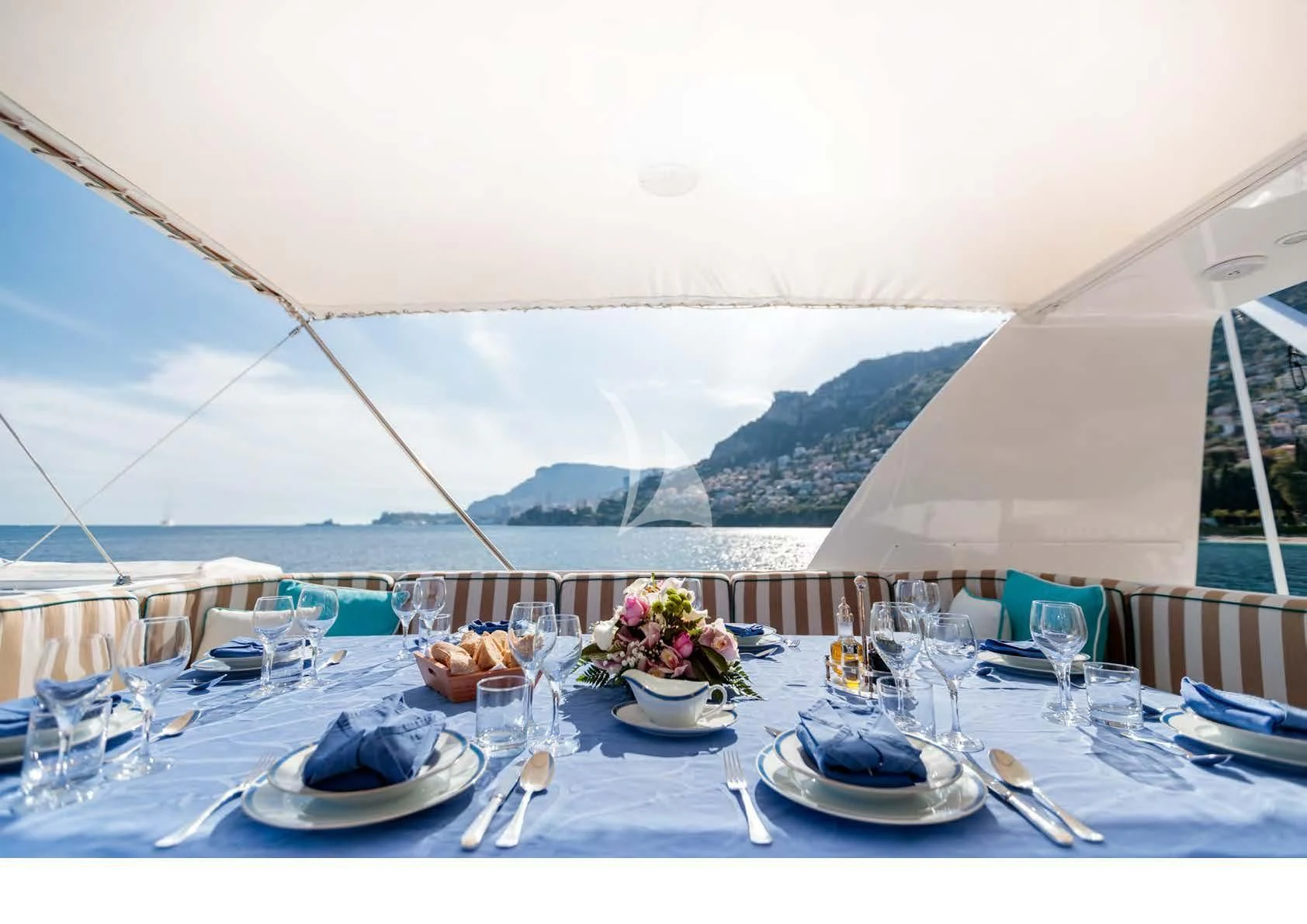 a table set for a dinner aboard HEMILEA Yacht for Charter