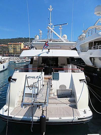 a boat docked at a pier aboard HEMILEA Yacht for Charter