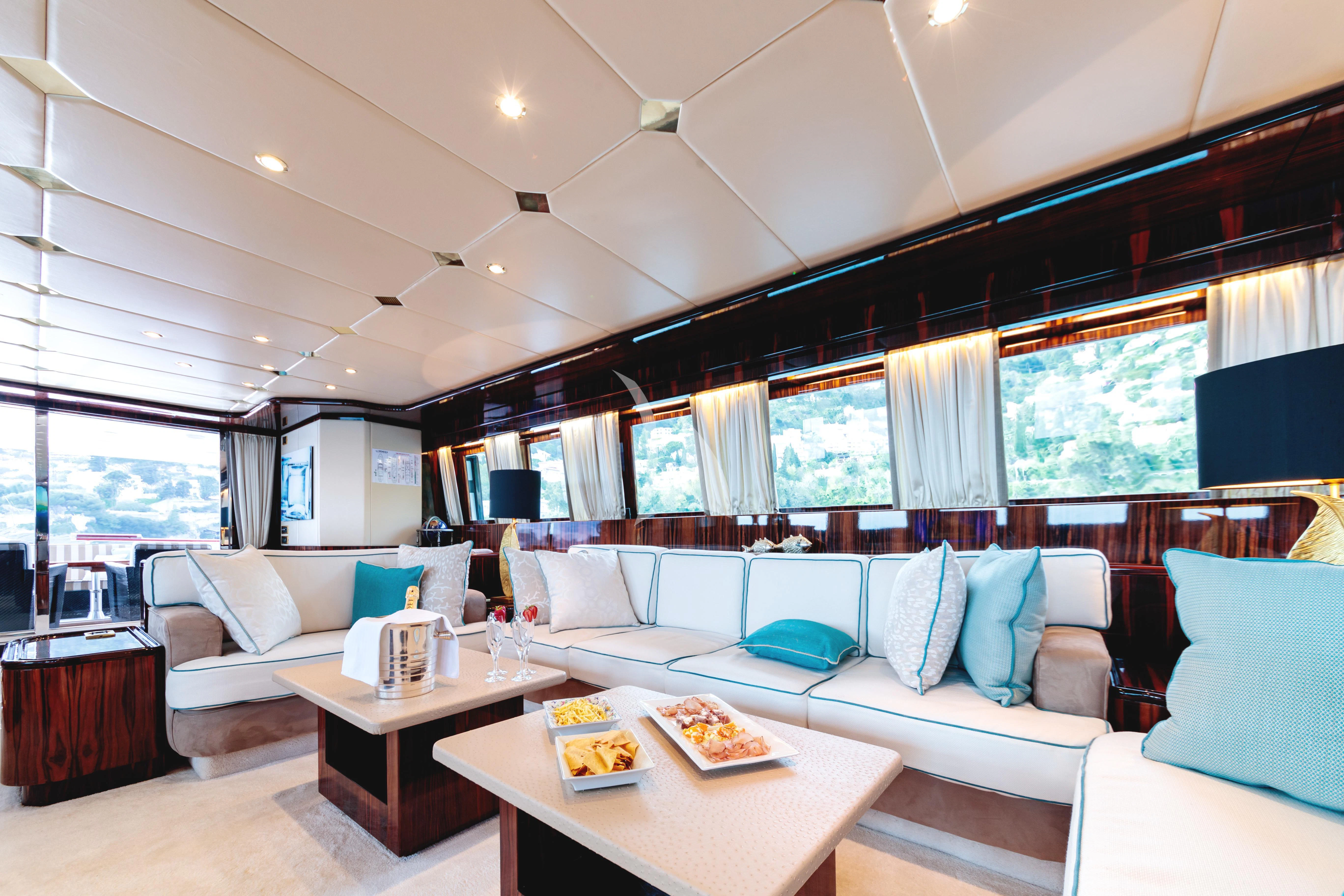a living room with a large window aboard HEMILEA Yacht for Charter