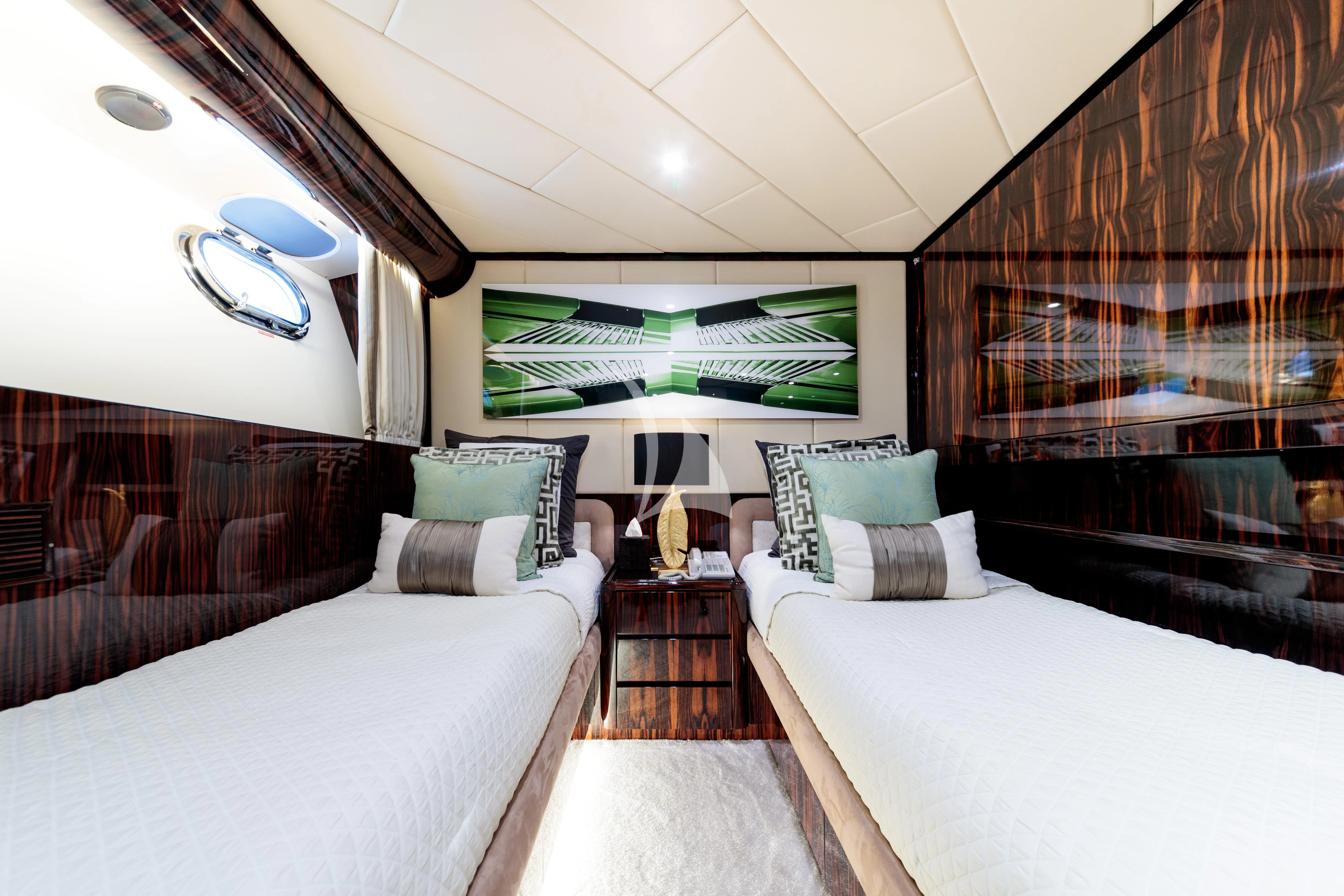 a room with a bed and a couch aboard HEMILEA Yacht for Charter