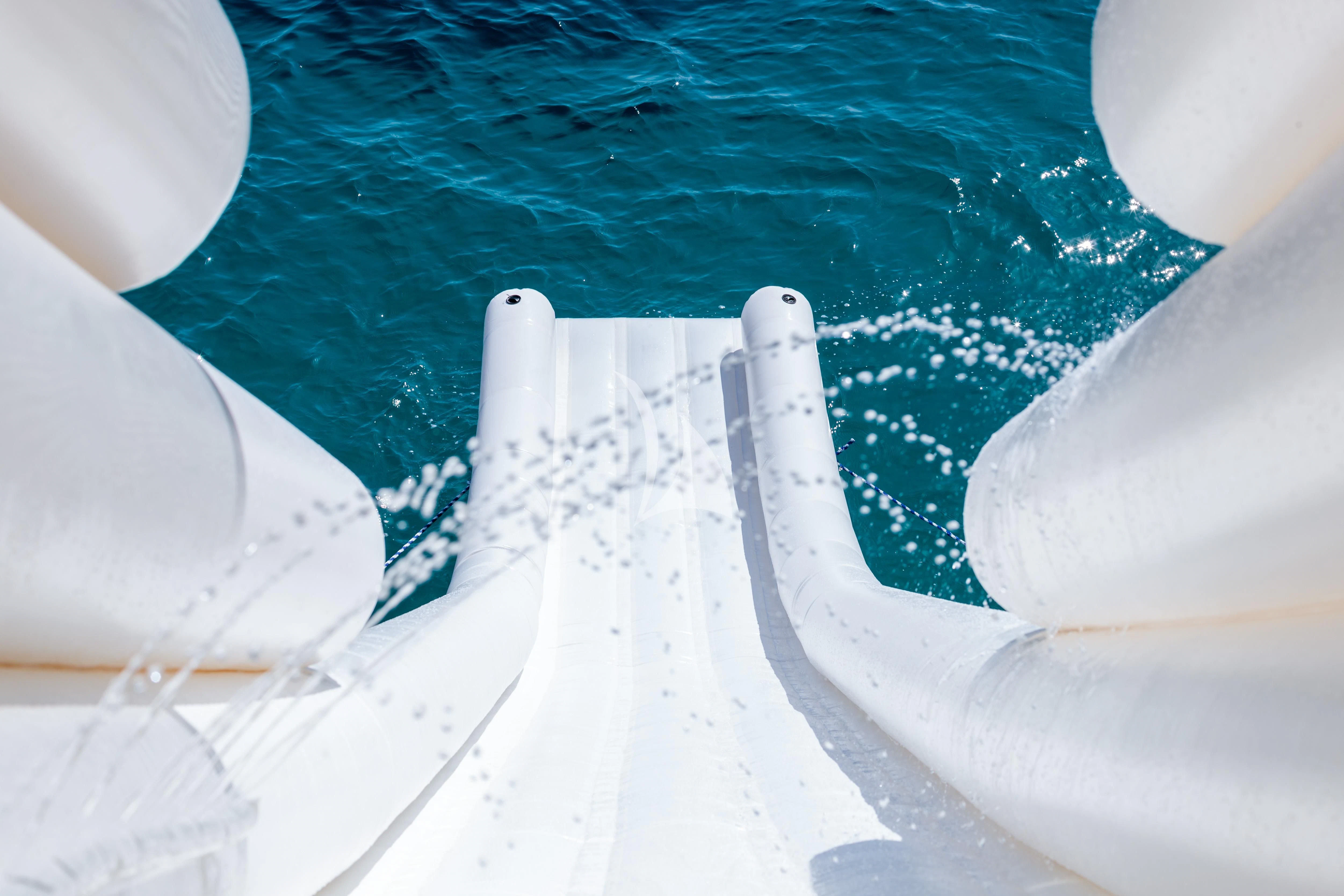 close-up of a hand holding a white object aboard HEMILEA Yacht for Charter