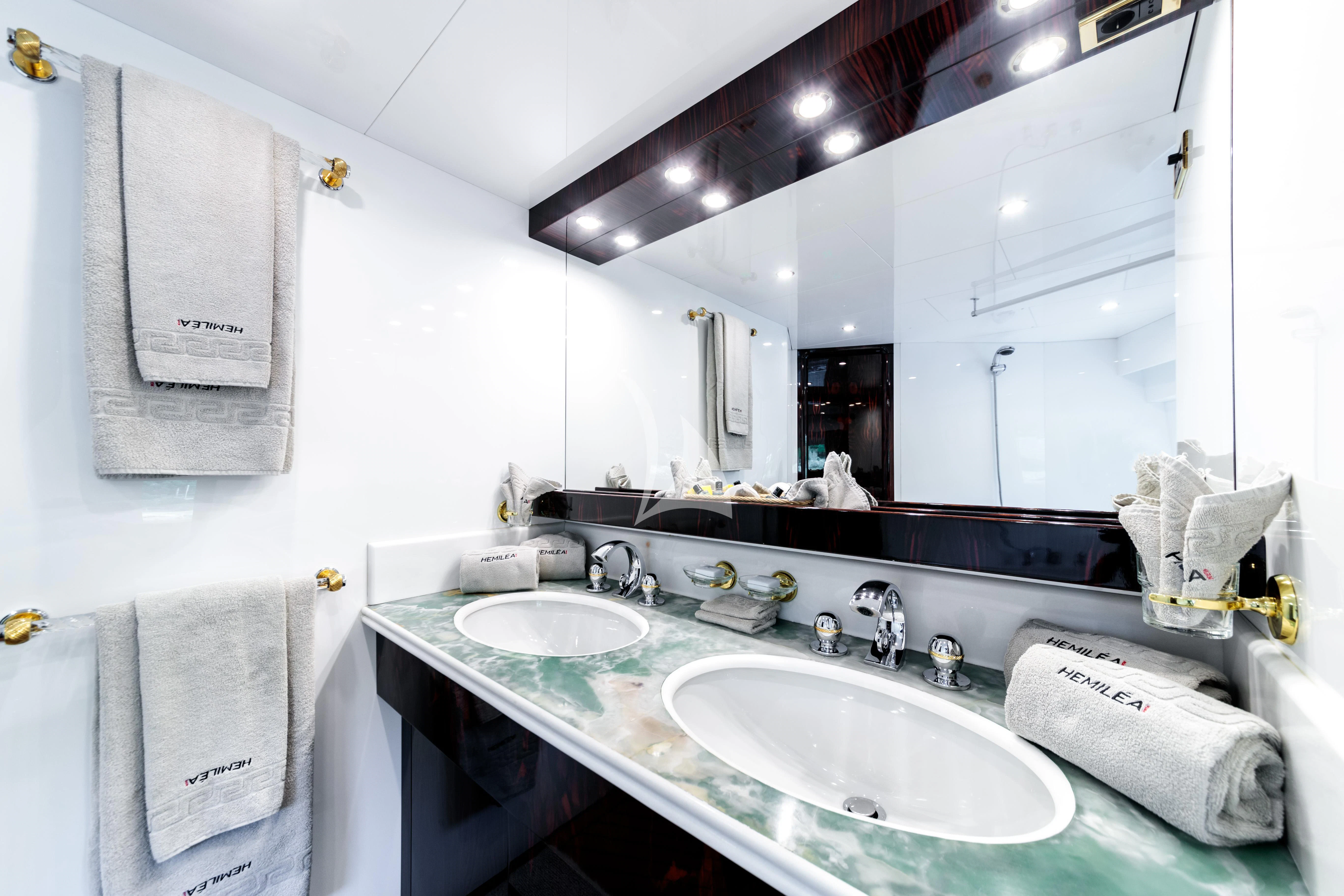 a bathroom with two sinks aboard HEMILEA Yacht for Charter