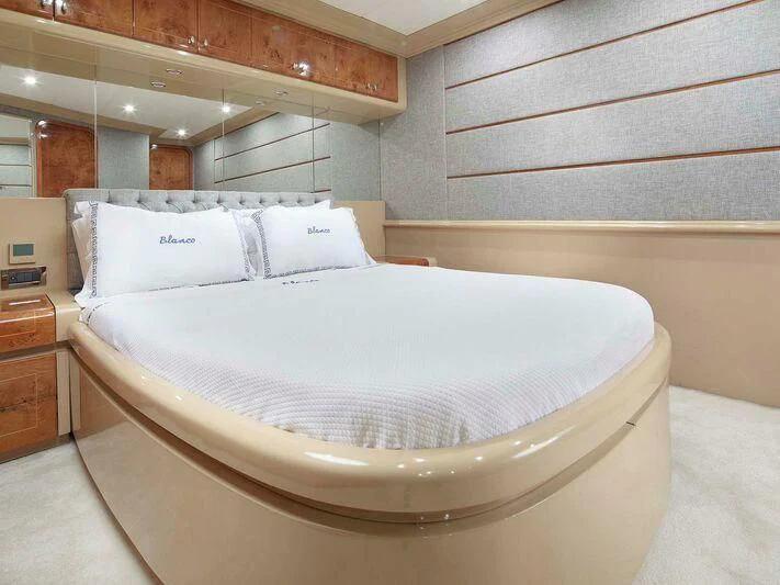a bed with white sheets aboard BLANCO Yacht for Sale