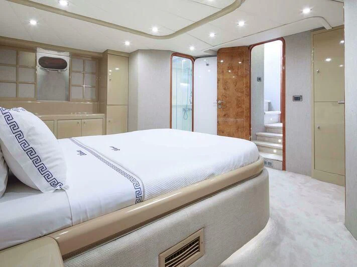 a room with a bed and a mirror aboard BLANCO Yacht for Sale