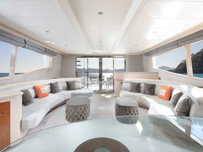 a living room with a large glass window aboard BLANCO Yacht for Sale