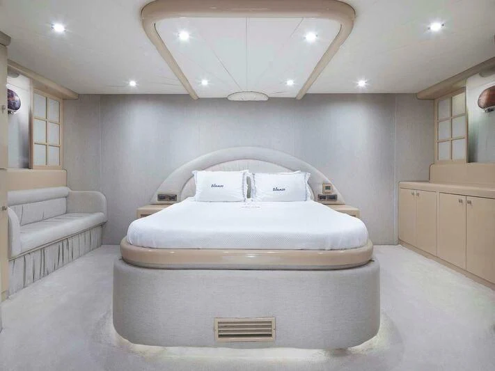 a white bed in a room aboard BLANCO Yacht for Sale