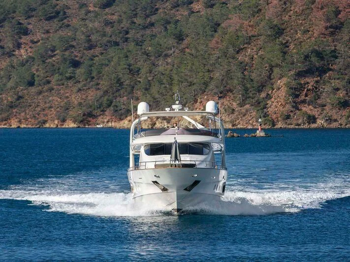 a white boat on the water aboard BLANCO Yacht for Sale