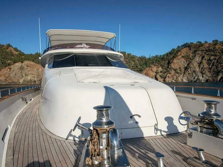 a white boat on a deck aboard BLANCO Yacht for Sale