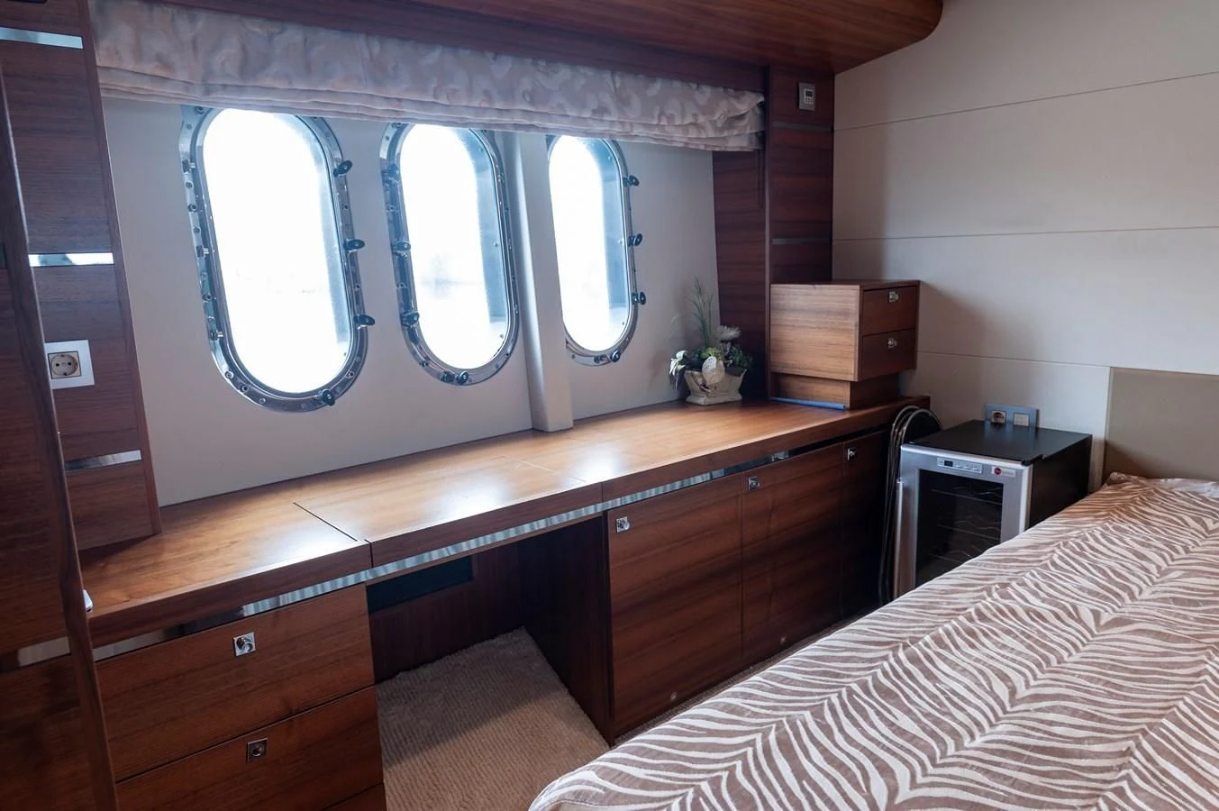 a room with a bed and a large mirror aboard ANGELS Yacht for Sale