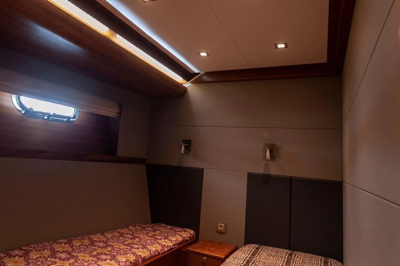 a room with a bed and a window aboard ANGELS Yacht for Sale