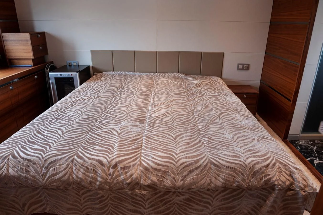 a bed with a white comforter aboard ANGELS Yacht for Sale