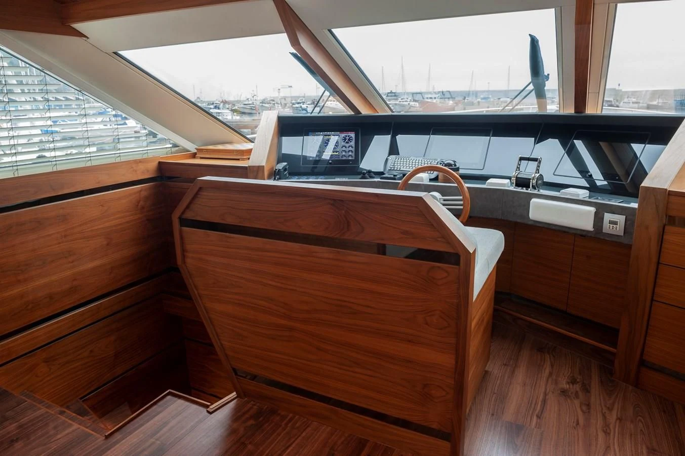 a wooden chair on a deck aboard ANGELS Yacht for Sale