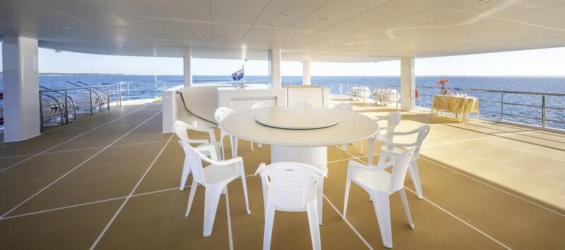 a room with a table and chairs aboard CHARLEY 2 Yacht for Sale