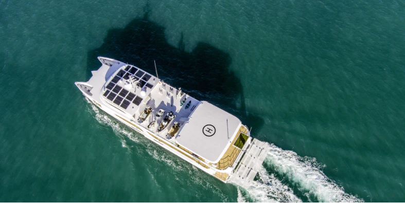 a large ship in the ocean aboard CHARLEY 2 Yacht for Sale