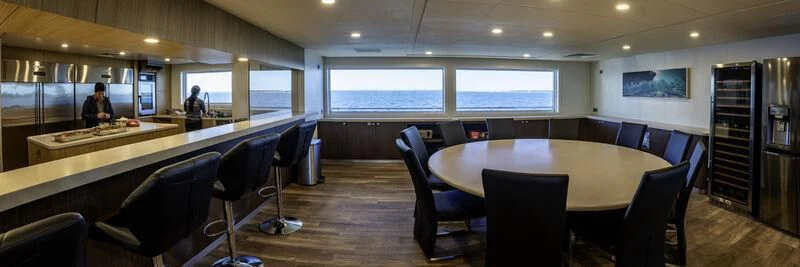 a room with a table and chairs aboard CHARLEY 2 Yacht for Sale
