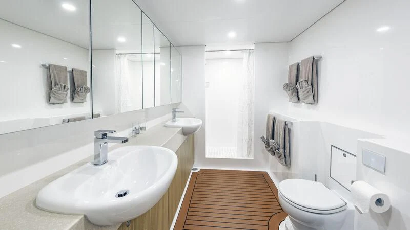a bathroom with a sink and a toilet aboard CHARLEY 2 Yacht for Sale