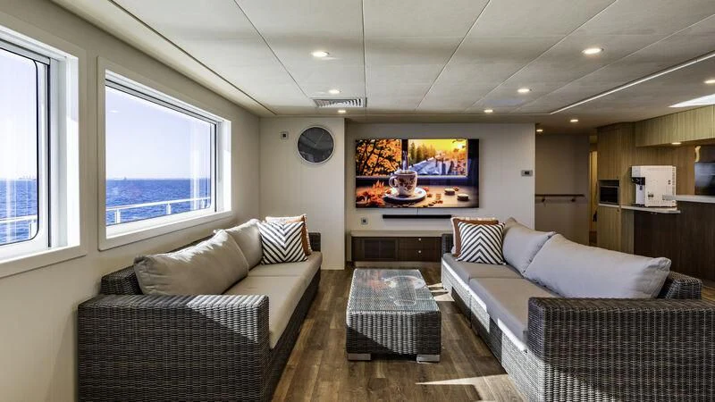 a living room with a couch and a tv aboard CHARLEY 2 Yacht for Sale