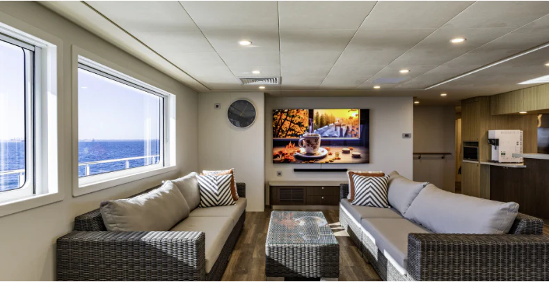a living room with a couch and a tv aboard CHARLEY 2 Yacht for Sale
