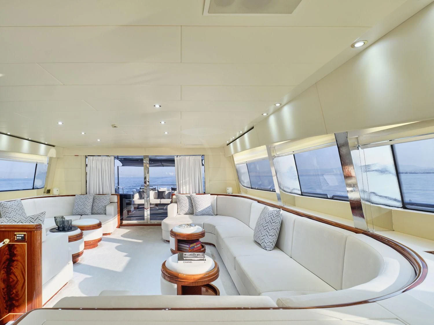 a room with a bed and a table aboard ABILITY Yacht for Sale