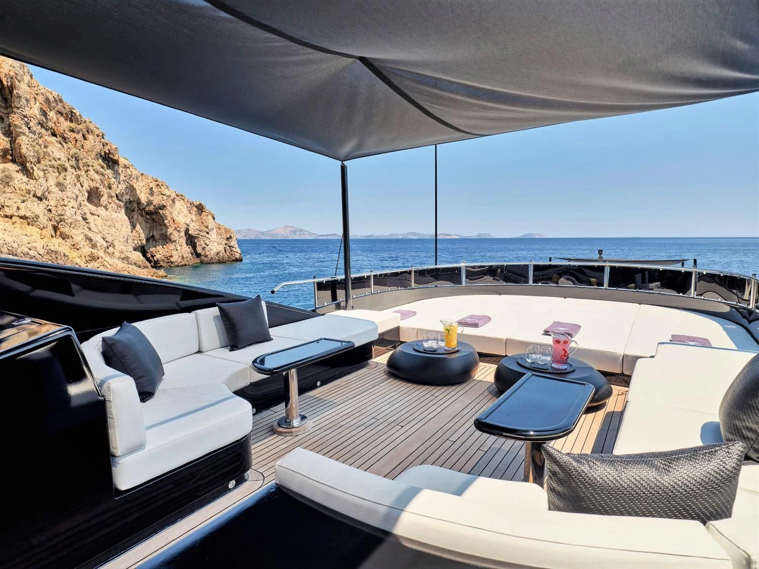 a patio with a table and chairs aboard ABILITY Yacht for Sale