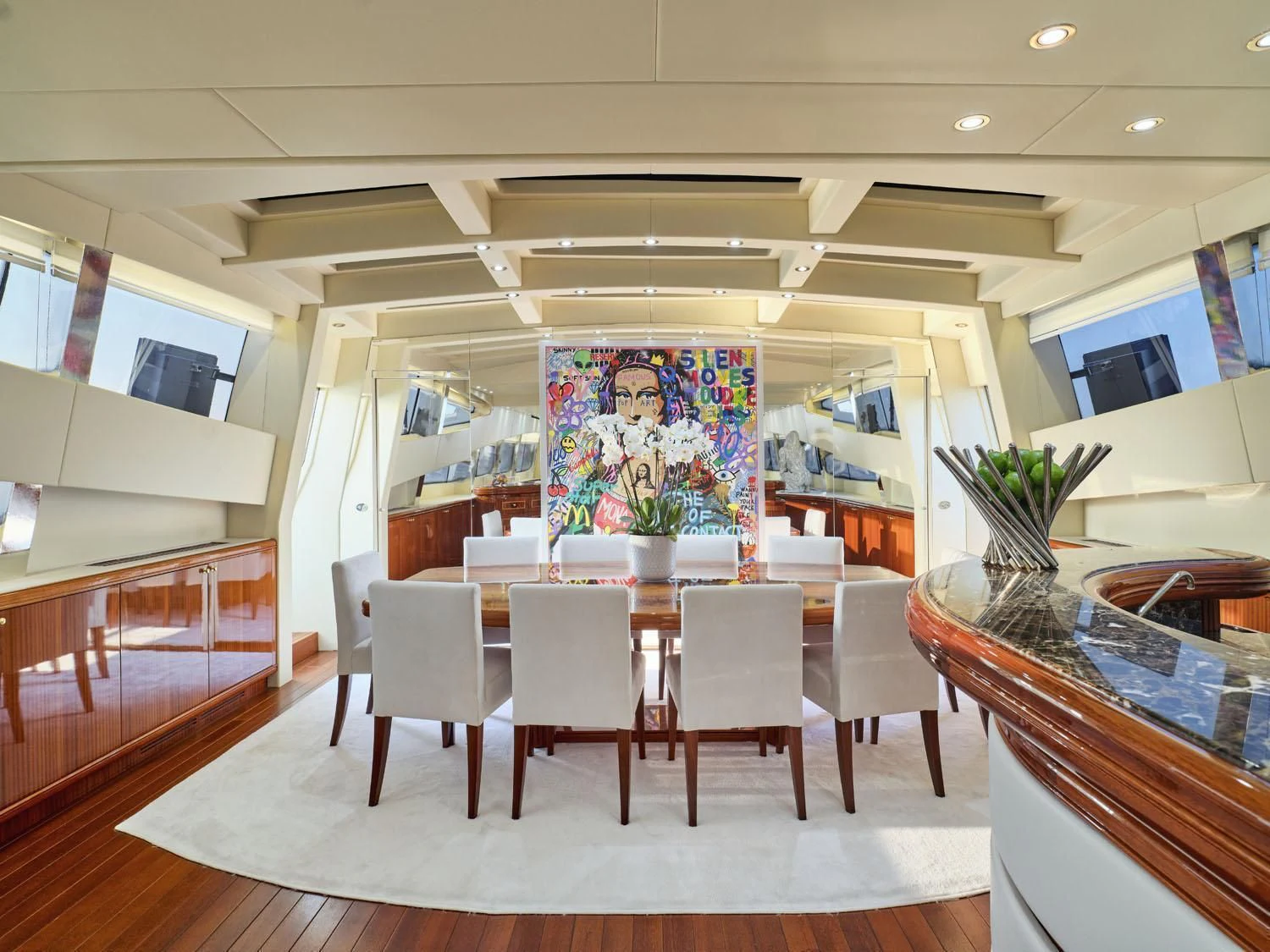 a room with tables and chairs aboard ABILITY Yacht for Sale