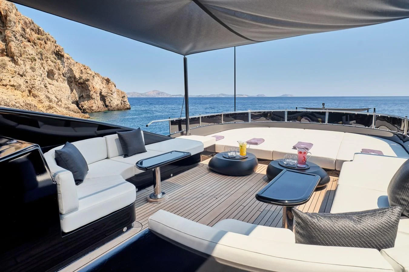 a patio with a table and chairs aboard ABILITY Yacht for Sale