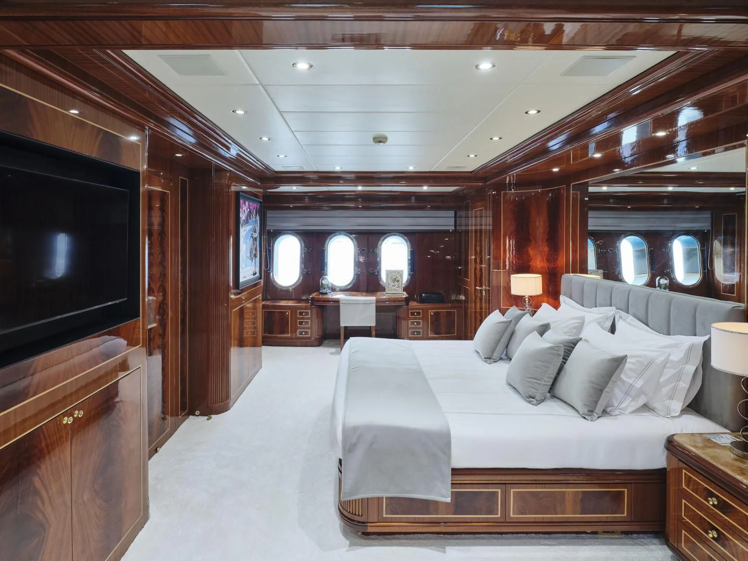 a room with a bed and a television aboard ABILITY Yacht for Sale